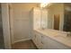 This bright bathroom features a large vanity with double sinks and a large mirror at 2733 Hunter Woods Dr # 570, Apex, NC 27502