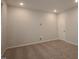 A bright bedroom is carpeted and has neutral walls and a window for natural light at 2733 Hunter Woods Dr # 570, Apex, NC 27502