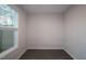 A bright bedroom offers natural light from a window and has modern, wood-look flooring at 2733 Hunter Woods Dr # 570, Apex, NC 27502