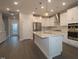 A well-lit kitchen offers modern stainless steel appliances, quartz countertops, and hardwood floors at 2733 Hunter Woods Dr # 570, Apex, NC 27502