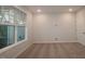 Bright living room with large window offering natural light and neutral carpet flooring at 2733 Hunter Woods Dr # 570, Apex, NC 27502