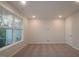 Living room is bright, features a large window for natural light, and is carpeted at 2733 Hunter Woods Dr # 570, Apex, NC 27502