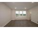 A spacious living room offers lots of natural light and hardwood floors in this new townhome at 2733 Hunter Woods Dr # 570, Apex, NC 27502