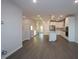 A spacious living area adjacent to the kitchen is light and bright with hardwood floors at 2733 Hunter Woods Dr # 570, Apex, NC 27502