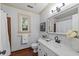 Beautiful bathroom with white marble countertops, modern fixtures, and charming accents at 2840 Mattlyn Ct, Raleigh, NC 27613