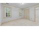 Inviting bedroom with ample natural light, soft carpet, and closet access at 2840 Mattlyn Ct, Raleigh, NC 27613