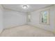 Bright, cozy bedroom with neutral carpet and dual windows offering natural light at 2840 Mattlyn Ct, Raleigh, NC 27613