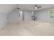 Spacious bonus room featuring neutral carpet, vaulted ceiling, and staircase at 2840 Mattlyn Ct, Raleigh, NC 27613