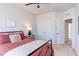Bedroom featuring a ceiling fan and a view of double doors and a closet at 2929 Great Lawn Rd, Apex, NC 27502