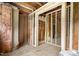 Raw interior with wooden beams and exposed framework, providing a unique remodeling opportunity at 310 Wood St, Gibsonville, NC 27249