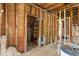 Unfinished interior with visible framework and infrastructure offering an opportunity for complete customization at 310 Wood St, Gibsonville, NC 27249