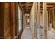 Exposed interior showing wooden studs and beams with the potential to transform into a custom space at 310 Wood St, Gibsonville, NC 27249