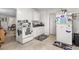 Cozy kitchen featuring white appliances, ample cabinet space, and tile flooring at 310 Wood St, Gibsonville, NC 27249