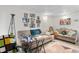 Comfortable living room features cozy couches, carpeted floors, and personal touches at 310 Wood St, Gibsonville, NC 27249