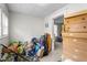 Cluttered room with an open doorway filled with furniture and boxes, needs decluttering to reveal its potential at 310 Wood St, Gibsonville, NC 27249