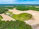 Breathtaking aerial view showcases the expansive property with farmland and lush landscaping at 3187 Wilsons Mills Rd, Smithfield, NC 27577