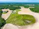 An aerial view of a house with a pond, surrounded by green fields, harvested fields, and trees at 3187 Wilsons Mills Rd, Smithfield, NC 27577