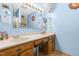 Bathroom boasting a double vanity with cabinets, a well-lit mirror and wood look flooring at 3187 Wilsons Mills Rd, Smithfield, NC 27577