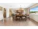 Dining room featuring hardwood floors, a contemporary light fixture, and natural light at 3187 Wilsons Mills Rd, Smithfield, NC 27577