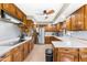 Bright kitchen features wood cabinets, stainless steel appliances, and a light countertop at 3187 Wilsons Mills Rd, Smithfield, NC 27577