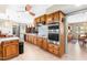 Bright kitchen features wood cabinets, stainless steel appliances, and built in double oven at 3187 Wilsons Mills Rd, Smithfield, NC 27577