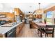 Spacious kitchen features wood cabinets, stainless steel appliances, and a dining area with natural light at 3187 Wilsons Mills Rd, Smithfield, NC 27577