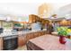 Bright kitchen with wood cabinets, a stainless steel refrigerator, and an attached dining table at 3187 Wilsons Mills Rd, Smithfield, NC 27577