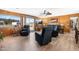 Spacious living room featuring wood paneled walls, recliners, and view to backyard at 3187 Wilsons Mills Rd, Smithfield, NC 27577