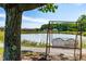 Picturesque metal swing overlooking a serene pond, offering peaceful relaxation and scenic views at 3187 Wilsons Mills Rd, Smithfield, NC 27577