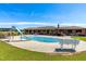 Backyard oasis with a refreshing pool, slide, and expansive patio for ultimate outdoor enjoyment at 3187 Wilsons Mills Rd, Smithfield, NC 27577