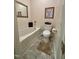 Clean bathroom featuring a soaking tub, modern toilet, and neutral decor at 364 Bayleigh Ct, Garner, NC 27529