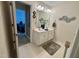 Well-lit bathroom features double sinks, white cabinets, and neutral decor at 364 Bayleigh Ct, Garner, NC 27529