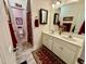 Bathroom featuring a double sink vanity and a separate area for the toilet and shower at 364 Bayleigh Ct, Garner, NC 27529