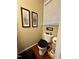 Half bathroom features a toilet, hardwood floors, and neutral-colored walls, creating a simple and functional space at 364 Bayleigh Ct, Garner, NC 27529