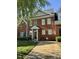 Charming brick townhome featuring a well-manicured front lawn and inviting front entrance at 364 Bayleigh Ct, Garner, NC 27529
