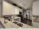 Modern kitchen features granite countertops, stainless steel appliances, and subway tile backsplash at 364 Bayleigh Ct, Garner, NC 27529