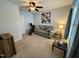 Cozy living room features a loveseat, ceiling fan, and exercise bike at 364 Bayleigh Ct, Garner, NC 27529