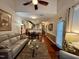 Open-concept living room with hardwood floors, comfortable seating, and seamless flow into the kitchen at 364 Bayleigh Ct, Garner, NC 27529
