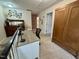 Open loft featuring hardwood cabinet, modern desk setup, and bright neutral walls, perfect for a functional workspace at 364 Bayleigh Ct, Garner, NC 27529