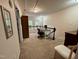 Cozy loft space with carpet, built-in storage, and natural light offers a versatile area for work or relaxation at 364 Bayleigh Ct, Garner, NC 27529