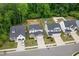 Aerial view of a neighborhood showcasing well-maintained homes and landscaped yards at 389 Whetstone Dr, Angier, NC 27501
