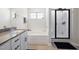 Well-lit bathroom showcasing a soaking tub and shower with a glass door at 389 Whetstone Dr, Angier, NC 27501