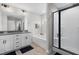 Modern bathroom features double vanity, soaking tub, and sleek glass shower at 389 Whetstone Dr, Angier, NC 27501