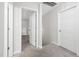 Clean hallway with two doors, one leading to the interior and the other with a closed, modern style at 389 Whetstone Dr, Angier, NC 27501