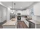 Well-equipped kitchen featuring stainless steel appliances, granite counters, and ample cabinet space at 389 Whetstone Dr, Angier, NC 27501