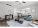 Open living space featuring hardwood floors, comfortable seating, and seamless flow to the kitchen at 389 Whetstone Dr, Angier, NC 27501