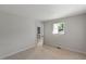 Simple bedroom with neutral carpet, soft gray walls, and a standard window at 411 Brampton Close, Pittsboro, NC 27312