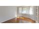 Bright bedroom featuring a bay window with plenty of natural light and parquet floors at 411 Brampton Close, Pittsboro, NC 27312