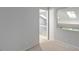 Spacious bedroom featuring neutral carpet, soft gray walls, and a large mirror at 411 Brampton Close, Pittsboro, NC 27312