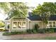 Charming building exterior with large windows and beautiful landscaping at 411 Brampton Close, Pittsboro, NC 27312